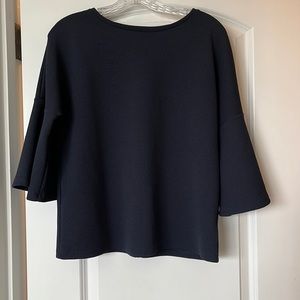 New condition. Womens dress top size Medium. Flowy arms, navy blue